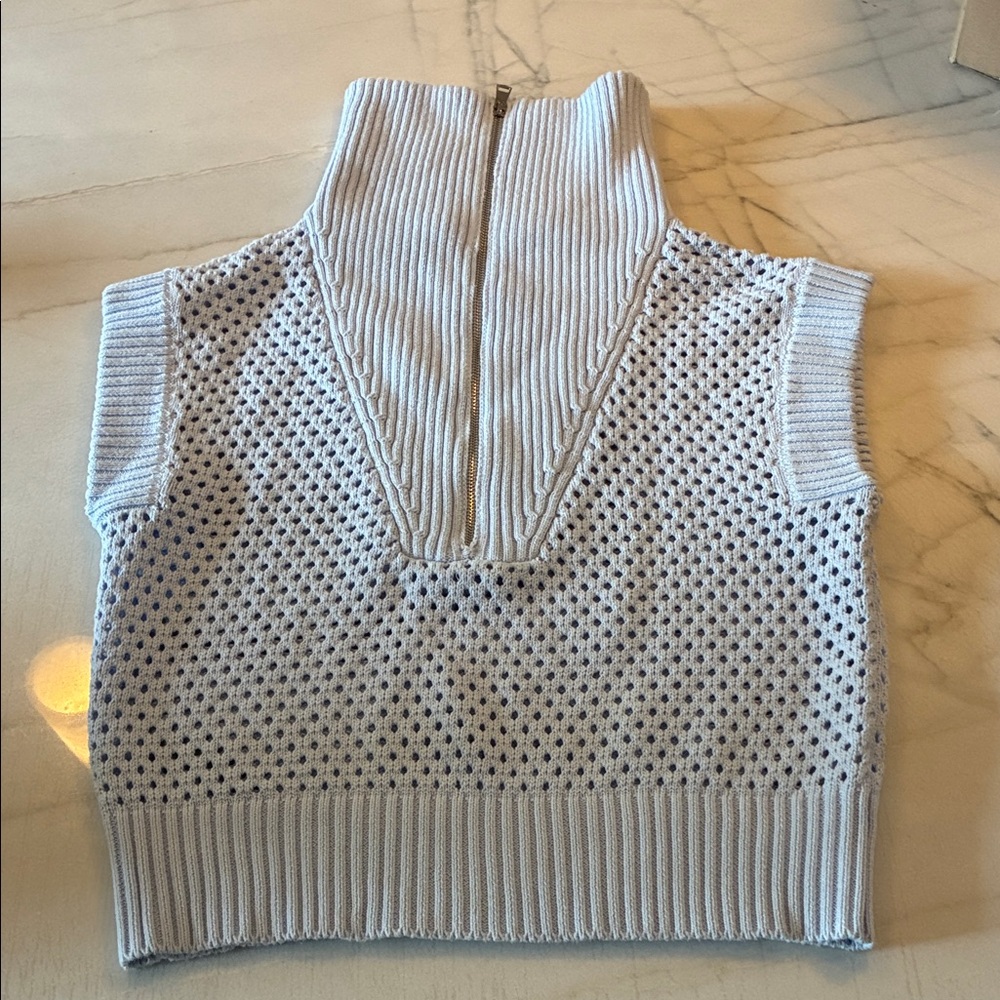 Magaschoni Light Blue Sleeveless Knit Sweater with Zipper.
